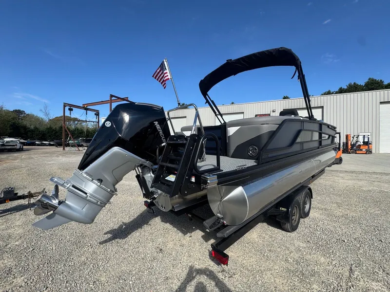 Slide: The Image of Evotti 525QL pontoon boat 2026 with outboard motor on trailer. - 15