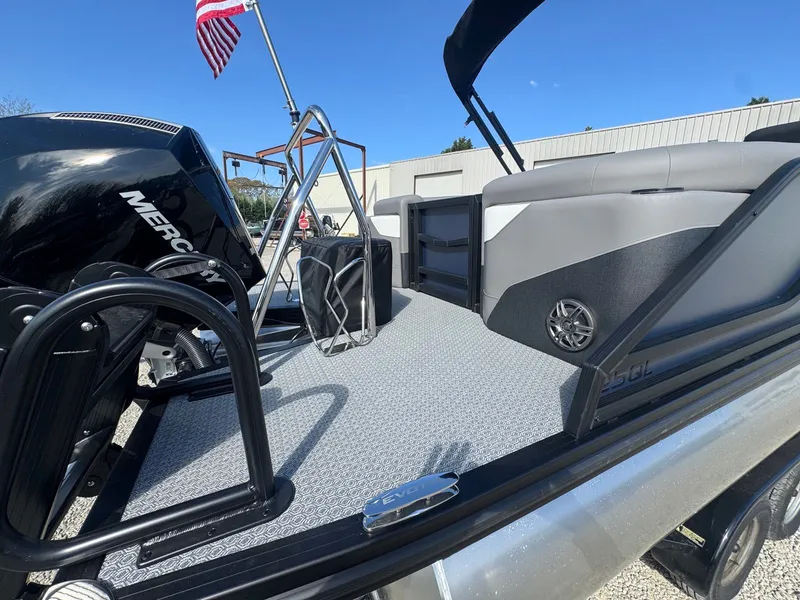 Slide: The Image of Evotti 525QL pontoon boat 2026 with Mercury engine and American flag. - 16