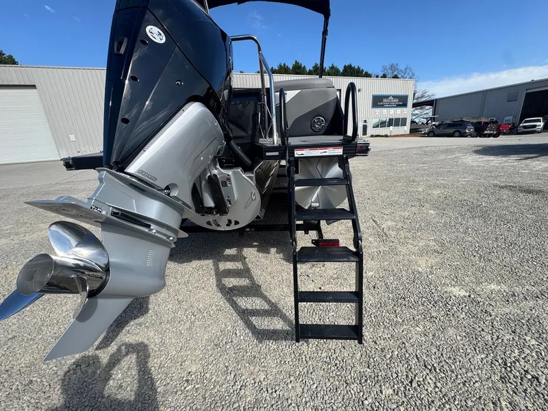 Slide: The Image of Evotti 525QL 2026 boat with outboard motor and ladder. - 17