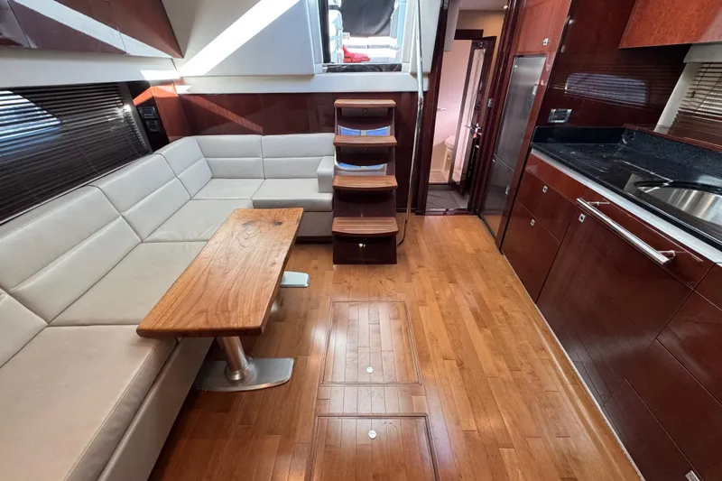 Slide: The Image of Luxurious kitchen interior of 2010 Sea Ray 470 Sundancer yacht with sleek cabinetry. - 17