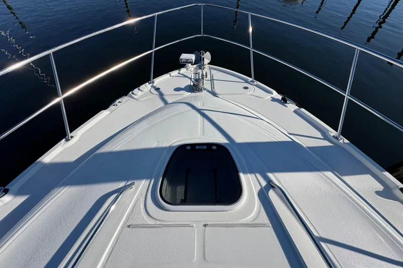 Slide: The Image of Luxurious kitchen interior of 2010 Sea Ray 470 Sundancer yacht with wood cabinetry and modern appliances. - 18