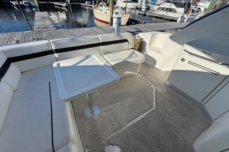 Slide: The Image of Luxurious 2010 Sea Ray 470 Sundancer yacht interior with sleek wood cabinetry and modern sink. - 22