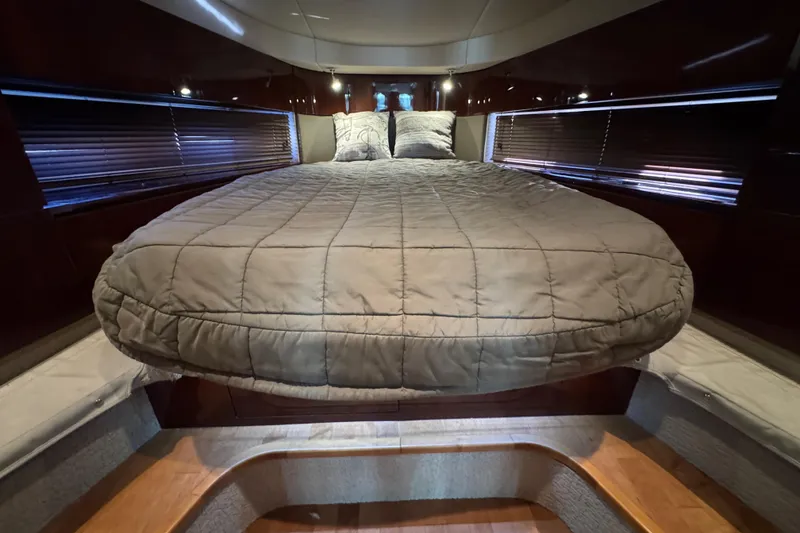 Slide: The Image of Luxurious cabin interior of 2010 Sea Ray 470 Sundancer yacht with elegant wood finishes. - 27