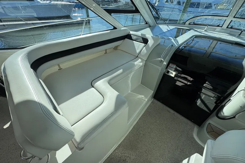 Slide: The Image of Luxurious 2010 Sea Ray 470 Sundancer yacht interior with sleek white seating and panoramic windows. - 5