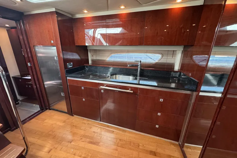 Slide: The Image of Interior cockpit of 2010 Sea Ray 470 Sundancer yacht with navigation controls. - 9