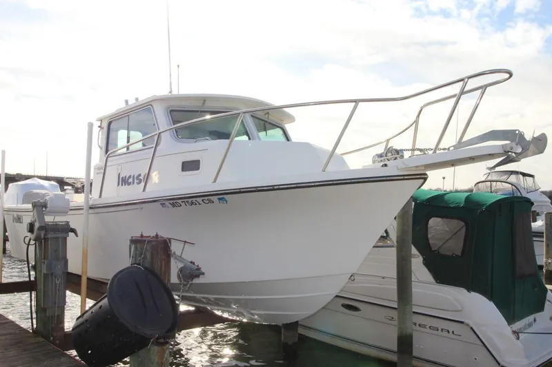 The Image of 2017 Parker 2820 XLD Sport Cabin boat docked at marina. - 1