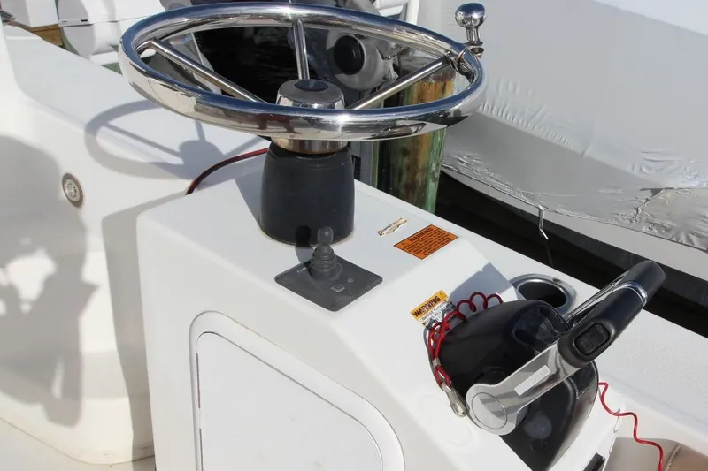 Slide: The Image of Steering console of 2017 Parker 2820 XLD Sport Cabin boat with throttle controls. - 10