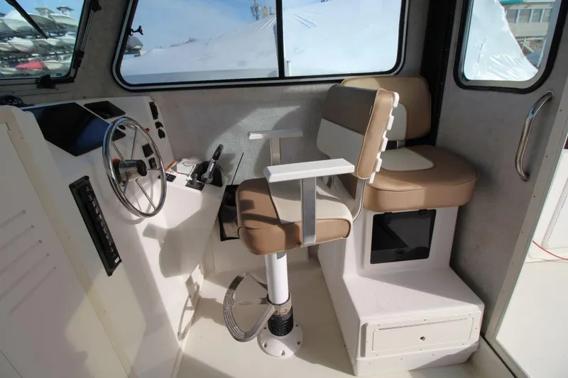 Slide: The Image of Interior of 2017 Parker 2820 XLD Sport Cabin with steering wheel and seating. - 16