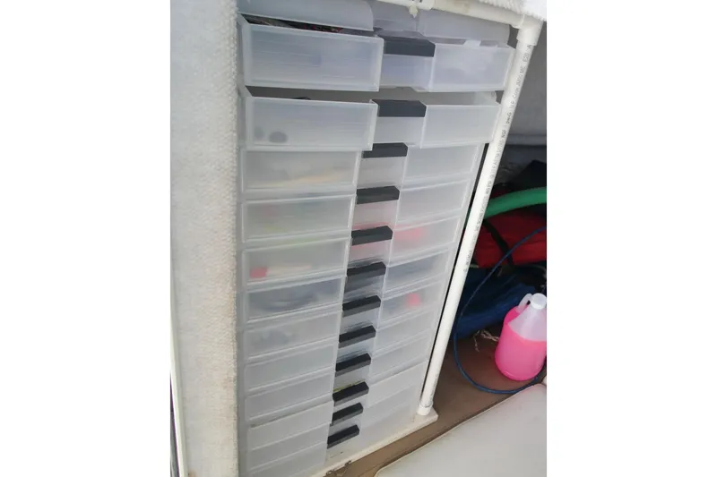 Slide: The Image of Storage drawers inside a 2017 Parker 2820 XLD Sport Cabin boat. - 20