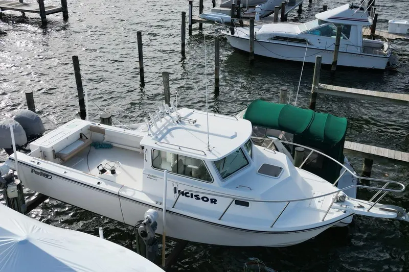 Slide: The Image of 2017 Parker 2820 XLD Sport Cabin boat docked at marina, aerial view. - 8