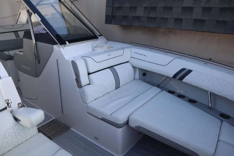 Slide: The Image of 2022 Regal LX36 boat interior with luxurious white seating and modern design. - 29