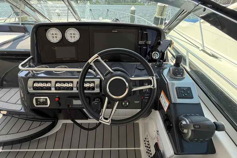 Slide: The Image of Cockpit of 2022 Formula 40 Performance Cruiser with steering wheel and control panel. - 10