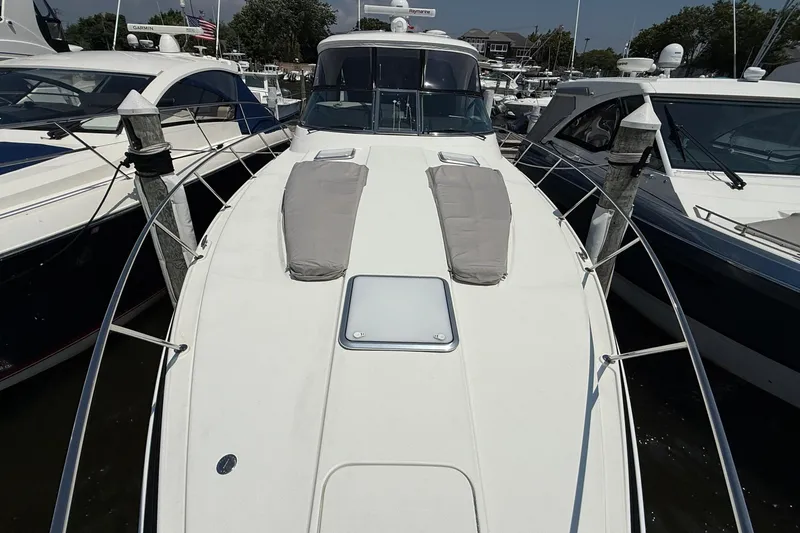 Slide: The Image of 2022 Formula 40 Performance Cruiser docked at marina, showcasing sleek design and spacious deck. - 2