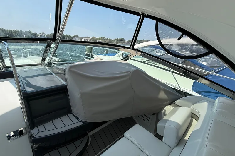 Slide: The Image of 2022 Formula 40 Performance Cruiser interior with covered helm and seating area. - 9