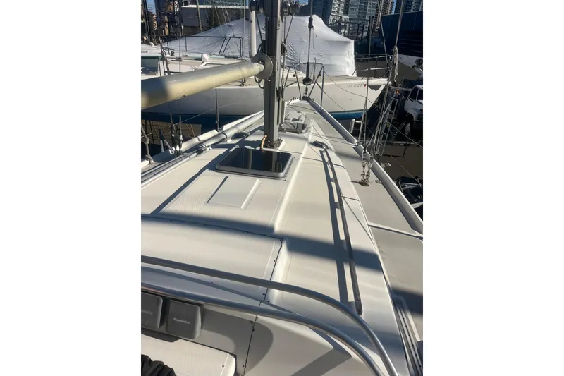 Slide: The Image of 1975 Contest 36 sailboat deck view at marina, showcasing mast and rigging. - 3