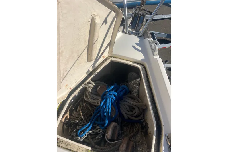 Slide: The Image of Open storage compartment on 1975 Contest 36 sailboat with ropes and anchor. - 5