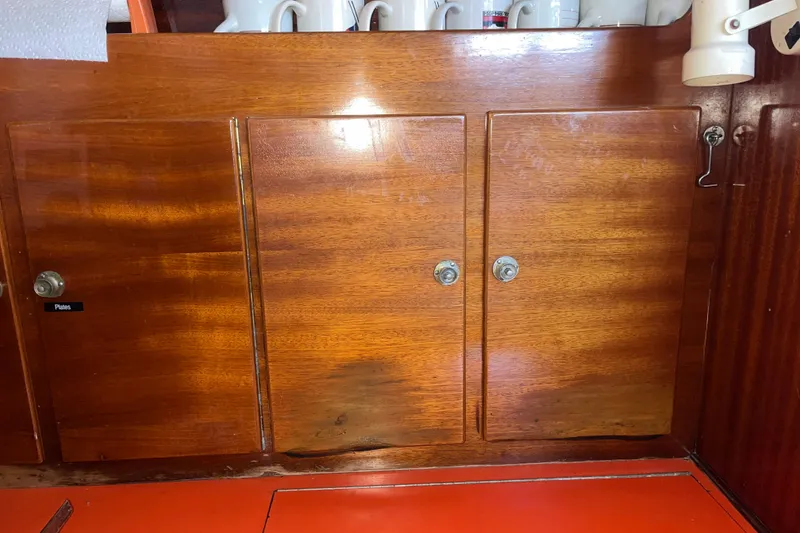 Slide: The Image of Wooden cabinets on a 1975 Contest 36 sailboat interior. - 9