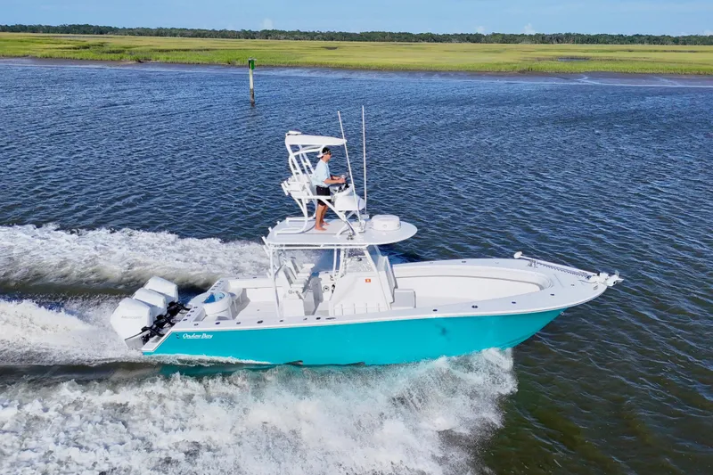 The Image of 2021 Onslow Bay 33 Tournament boat cruising on a sunny day. - 0
