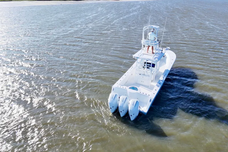 Slide: The Image of 2021 Onslow Bay 33 Tournament boat cruising on open water. - 11