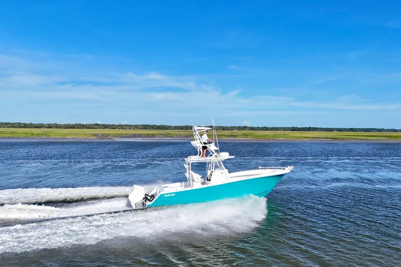Slide: The Image of 2021 Onslow Bay 33 Tournament boat cruising on a sunny day. - 37