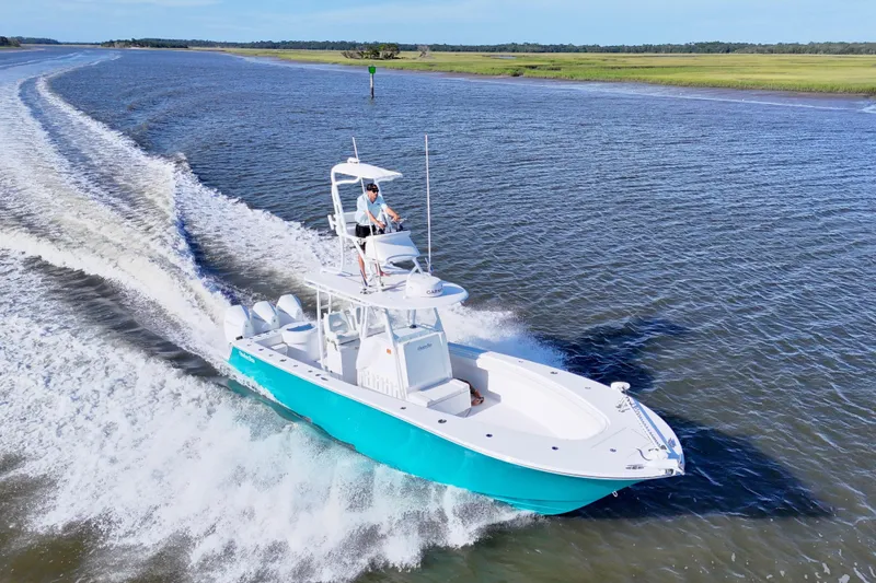 Slide: The Image of 2021 Onslow Bay 33 Tournament boat cruising on open water. - 39