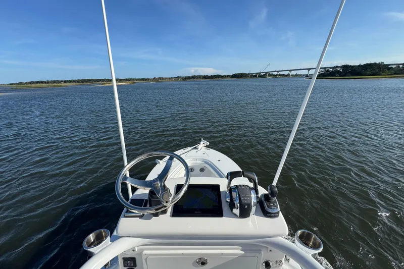 Slide: The Image of Onslow Bay 33 Tournament 2021 boat navigating calm waters with bridge in background. - 40