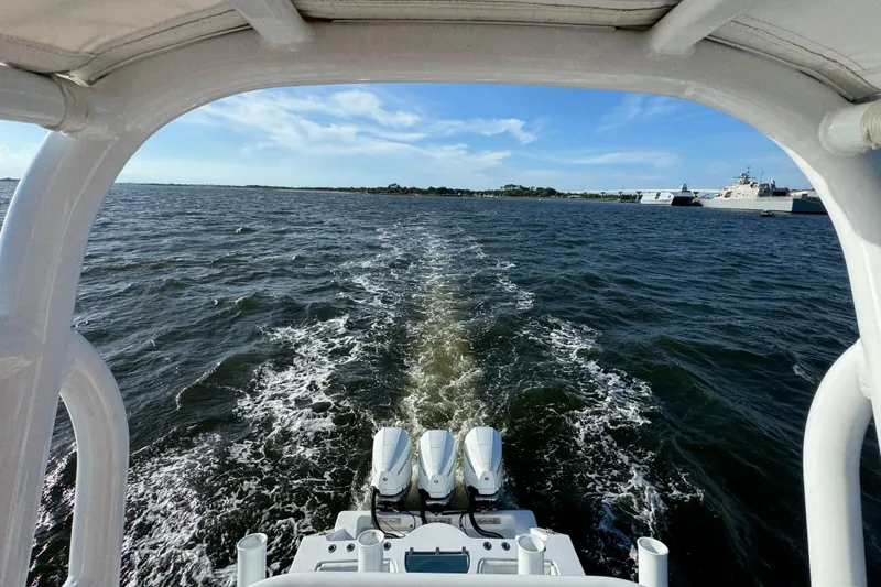 Slide: The Image of 2021 Onslow Bay 33 Tournament boat cruising on open water under clear skies. - 42