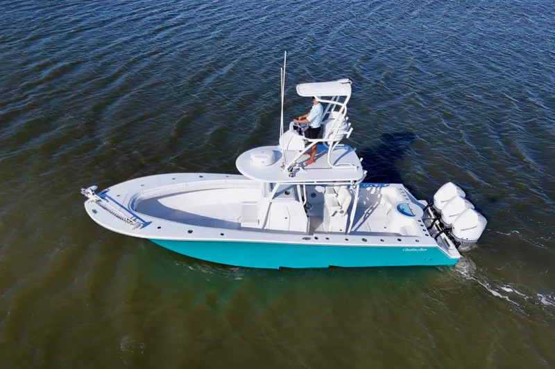 Slide: The Image of 2021 Onslow Bay 33 Tournament boat cruising on open water, aerial view. - 9
