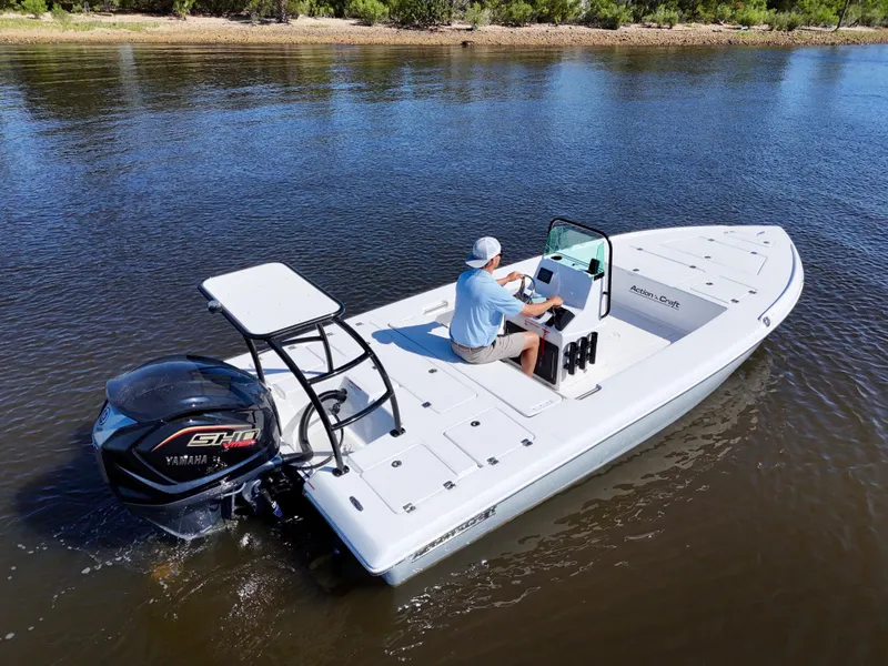 Slide: The Image of 2025 Action Craft 20 Flats boat on calm water, featuring a Yamaha engine. - 14
