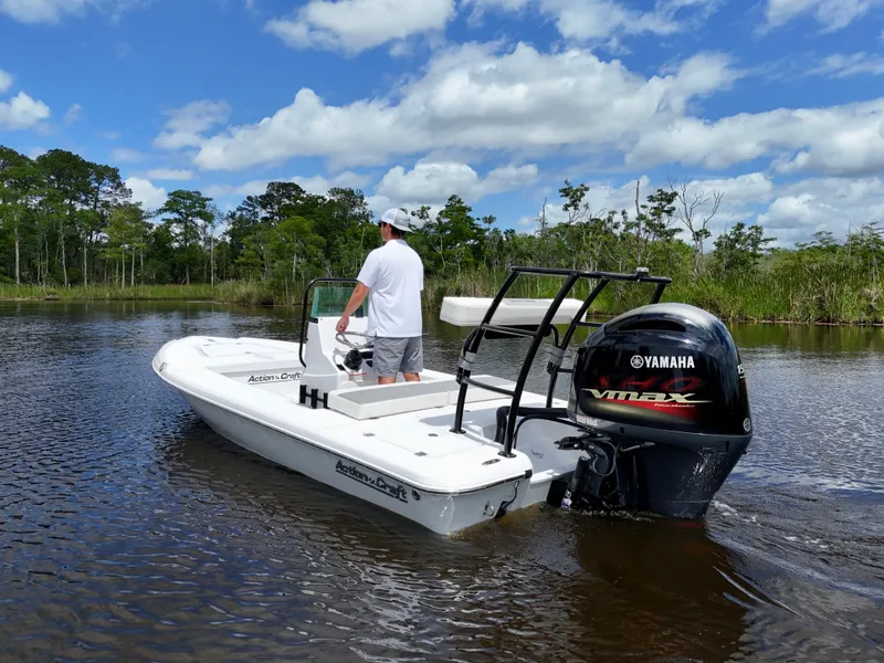 Slide: The Image of 2025 Action Craft 17 Flats boat with Yamaha VMAX engine on a calm river. - 3