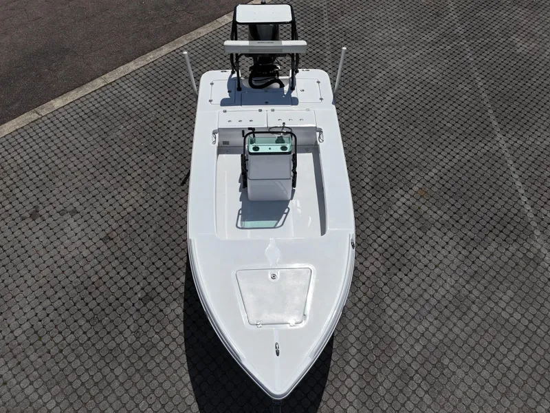 Slide: The Image of 2025 Action Craft 17 Flats boat, aerial view, on a textured surface. - 32