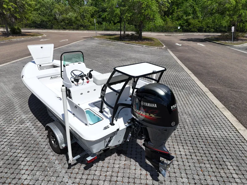 Slide: The Image of 2025 Action Craft 17 Flats boat with Yamaha engine, parked on a paved area. - 37