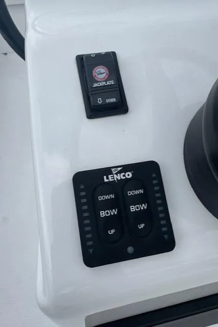 Slide: The Image of Control panel of a 2025 Action Craft 17 Flats boat with Lenco trim tab switches. - 48
