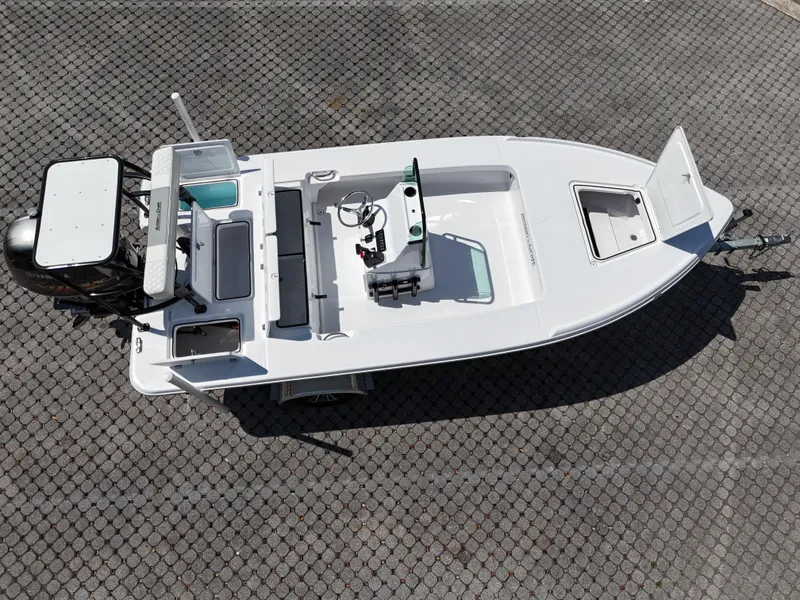 Slide: The Image of 2025 Action Craft 17 Flats boat, aerial view, on a textured surface. - 58