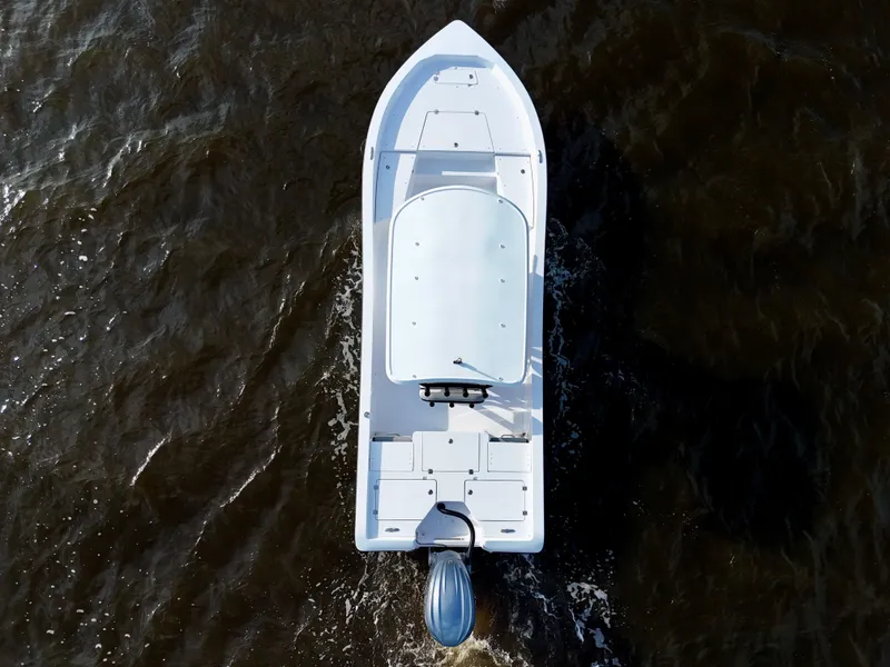 Slide: The Image of Aerial view of 2025 Action Craft 24 Coastal Bay boat on dark water. - 22