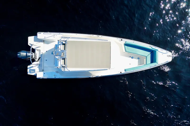 Slide: The Image of Aerial view of 2020 Axopar 28 CABIN boat on dark blue water. - 44
