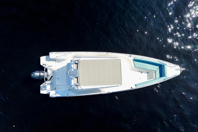Slide: The Image of Overhead view of 2020 Axopar 28 CABIN boat on sparkling water. - 28