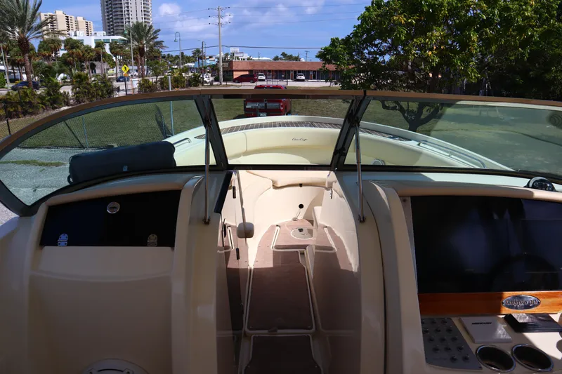 Slide: The Image of 2020 Chris-Craft Calypso 30 boat interior with dashboard and windshield view. - 22