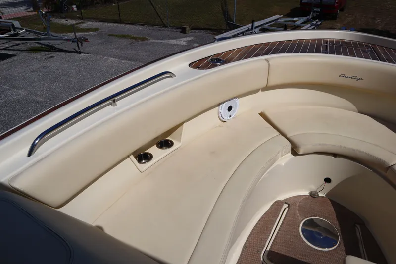 Slide: The Image of 2020 Chris-Craft Calypso 30 boat interior with beige seating and wood accents. - 24