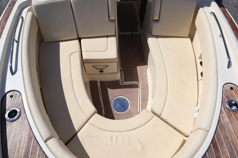 Slide: The Image of 2020 Chris-Craft Calypso 30 boat interior with beige seating and wood flooring. - 25