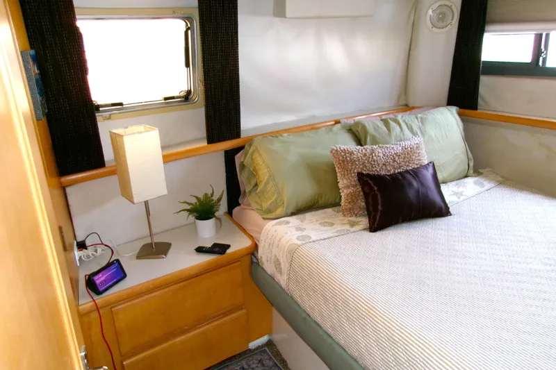 Slide: The Image of Cozy bedroom in 1995 Carver 355 Aft Cabin Motor Yacht with modern decor. - 17