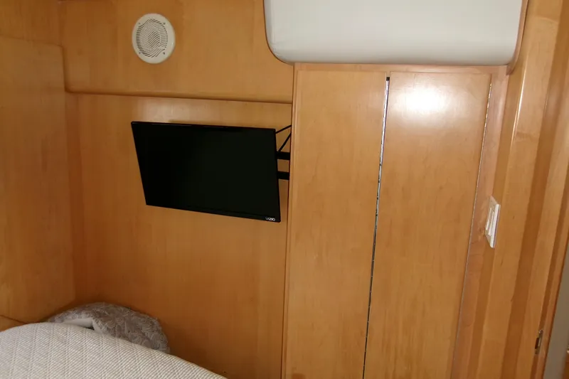 Slide: The Image of Interior of 1995 Carver 355 Aft Cabin Motor Yacht with mounted TV. - 19