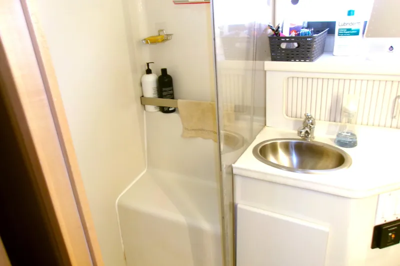 Slide: The Image of Bathroom interior of 1995 Carver 355 Aft Cabin Motor Yacht with sink and shower. - 20