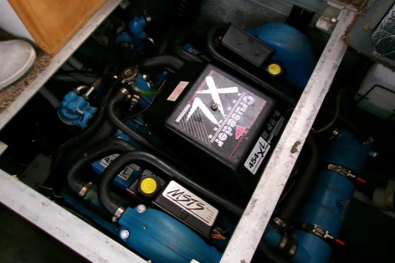 Slide: The Image of Engine compartment of 1995 Carver 355 Aft Cabin Motor Yacht, featuring Crusader engine. - 33