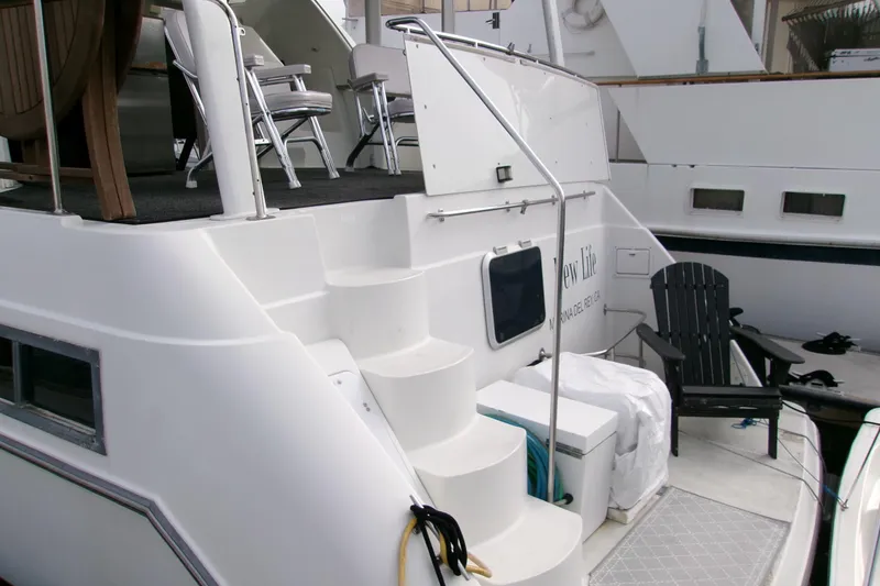 Slide: The Image of 1995 Carver 355 Aft Cabin Motor Yacht with outdoor seating and steps. - 5