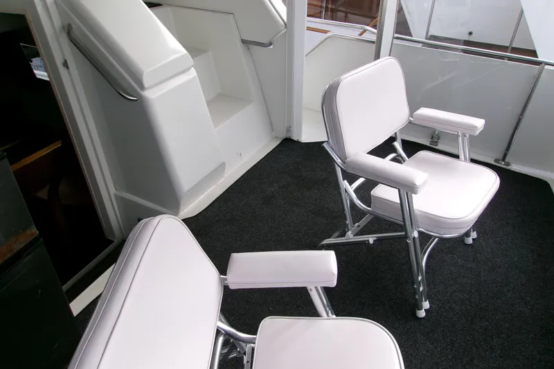 Slide: The Image of Interior of 1995 Carver 355 Aft Cabin Motor Yacht with white seating. - 8