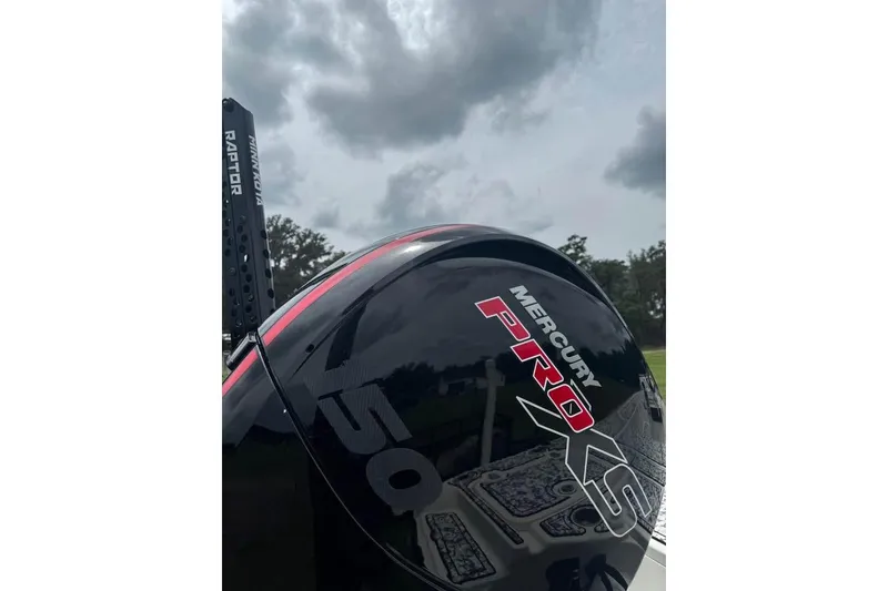 Slide: The Image of 2006 Triton 191 LTS with Mercury Pro XS engine under cloudy sky. - 5