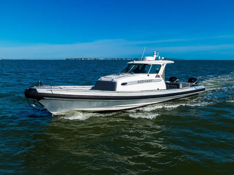 Slide: The Image of 2008 Protector 410 Targa boat on open sea. - 13