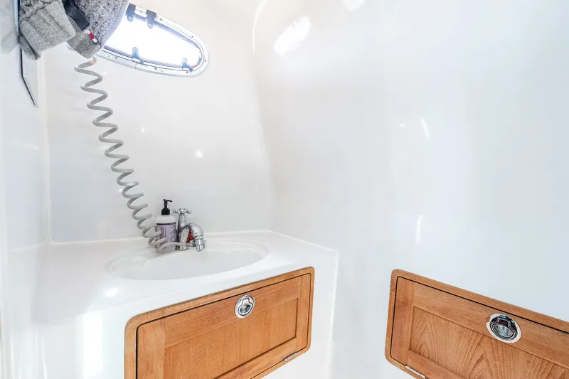 Slide: The Image of Interior of 2008 Protector 410 Targa with sink and wooden cabinets. - 22