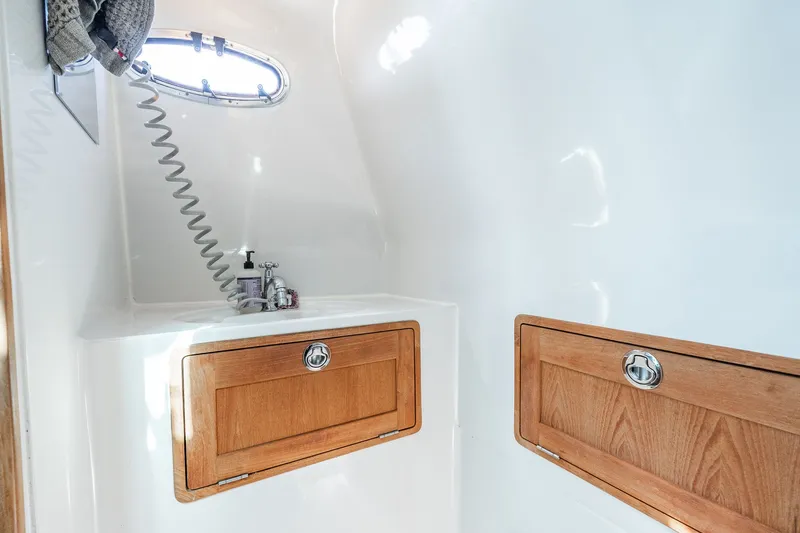 Slide: The Image of Interior of 2008 Protector 410 Targa with wooden cabinets. - 25